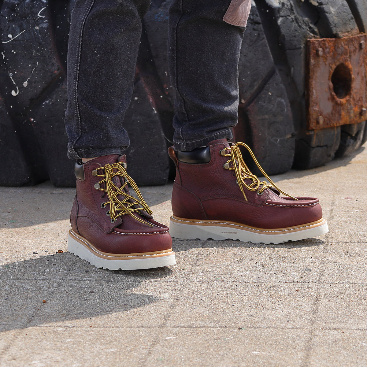 Work boots worn near heavy duty tires